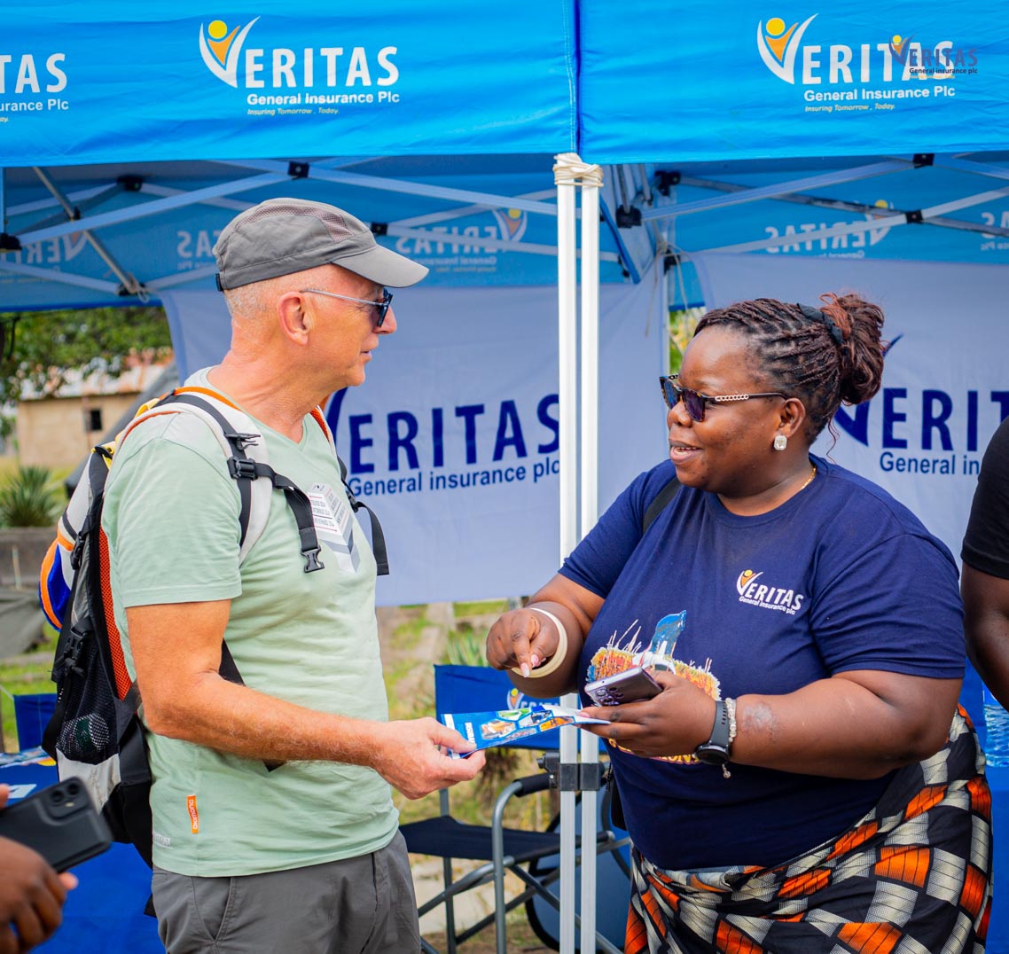 A Veritas representative in conversation with a visitor